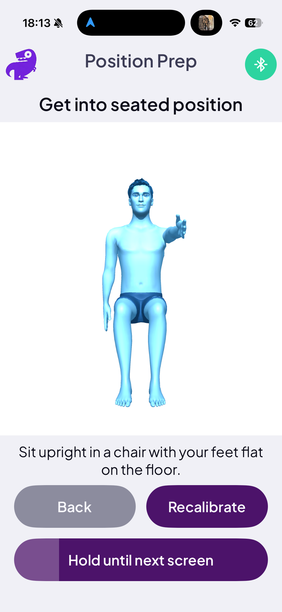 Position Prep screen with seated avatar and hold-until-next-screen button